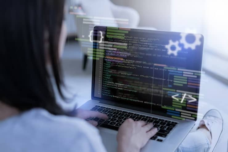 Woman Working on the Laptop with Code