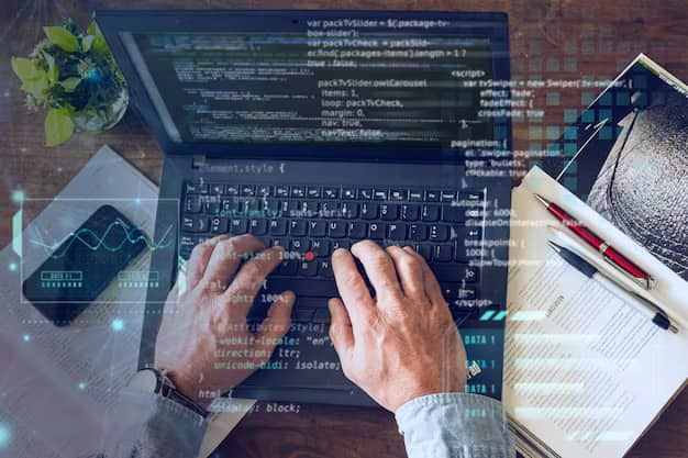 Human hands on a laptop keyboard, program code in the foreground