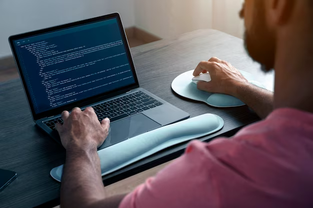 Man working on software code, rear view