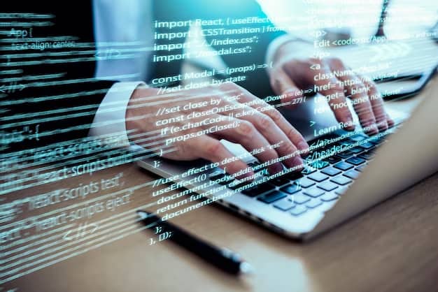 A man writes computer code on a laptop