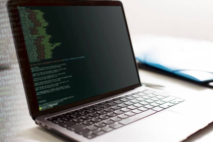 Laptop with Code on the Table